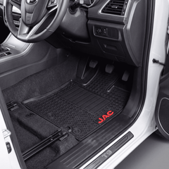 Haseen JAC T9 Hunter latex rubber PVC pickup floor mats installed – black honeycomb mat with red JAC logo, Pakistan