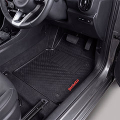 Black rubber car floor mats installed in a vehicle's front footwell, with the driver's seat visible and the brand name 'Picoalo' printed in red on the lower right mat.
