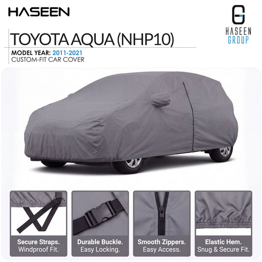A gray custom-fit car cover shown on a white background, with the text 'TOYOTA AQUA (NHP10)' and 'HASEEN' branding. Four inset detail panels at the bottom highlight secure straps, durable buckle, smooth zippers, and elastic hem.