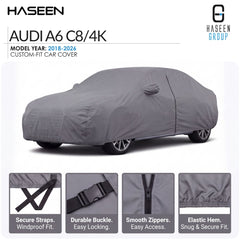 A gray custom-fit car cover shown fitted over a car on a white background, with HASEEN branding and text for an Audi A6 C8/4K model year 2018-2026. Four inset detail panels at the bottom show secure straps, durable buckle, smooth zippers, and elastic hem.