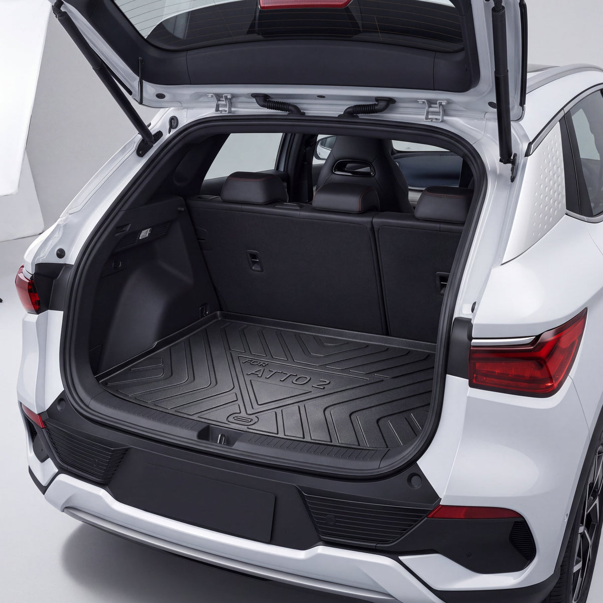Black custom-fit trunk mat installed in the boot of a BYD Atto 2 electric SUV