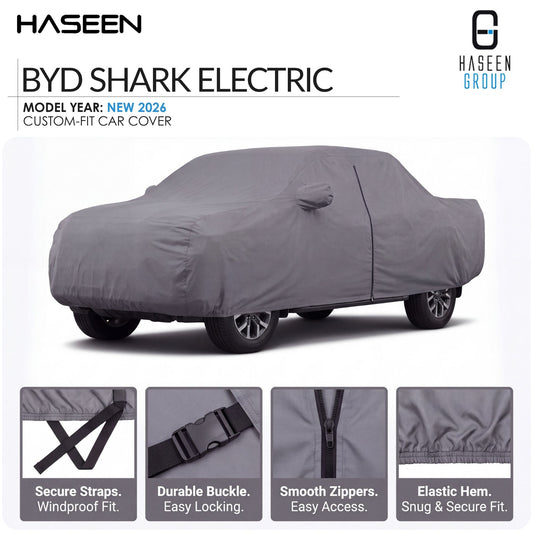 A gray car cover fitted over a sedan on a white background, with HASEEN branding and text reading 'BYD SHARK ELECTRIC' and 'MODEL YEAR: NEW 2026 CUSTOM-FIT CAR COVER.' Four inset detail panels at the bottom show secure straps, a durable buckle, smooth zippers, and elastic hem.