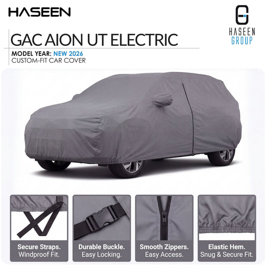 A gray custom-fit car cover shown on a car in a studio-style listing graphic. The image includes the HASEEN brand name, model text 'GAC AION UT ELECTRIC,' 'Model Year: New 2026,' and four feature callout panels at the bottom highlighting secure straps, durable buckle, smooth zippers, and elastic hem.