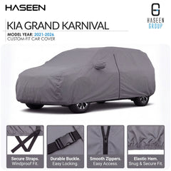A gray custom-fit car cover shown on a car silhouette, with HASEEN branding and text for a Kia Grand Karnival model year 2021-2026 cover. Four feature callout panels at the bottom highlight secure straps, durable buckle, smooth zippers, and elastic hem.