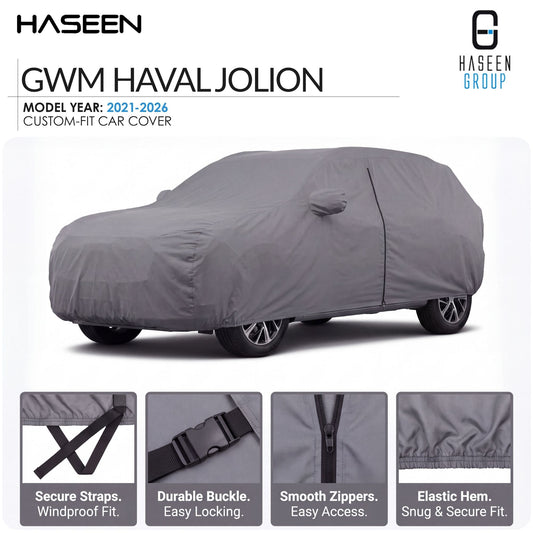 A gray custom-fit car cover shown on a car, with HASEEN branding and text reading 'GWM HAVAL JOLION' and 'Model Year: 2021-2026'. Four feature callout panels at the bottom highlight secure straps, durable buckle, smooth zippers, and elastic hem.