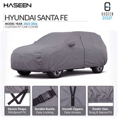 A gray custom-fit car cover shown on a Hyundai Santa Fe, with HASEEN branding and feature callouts along the bottom. The image includes text stating model year 2023-2026 and highlights such as secure straps, durable buckle, smooth zippers, and elastic hem.