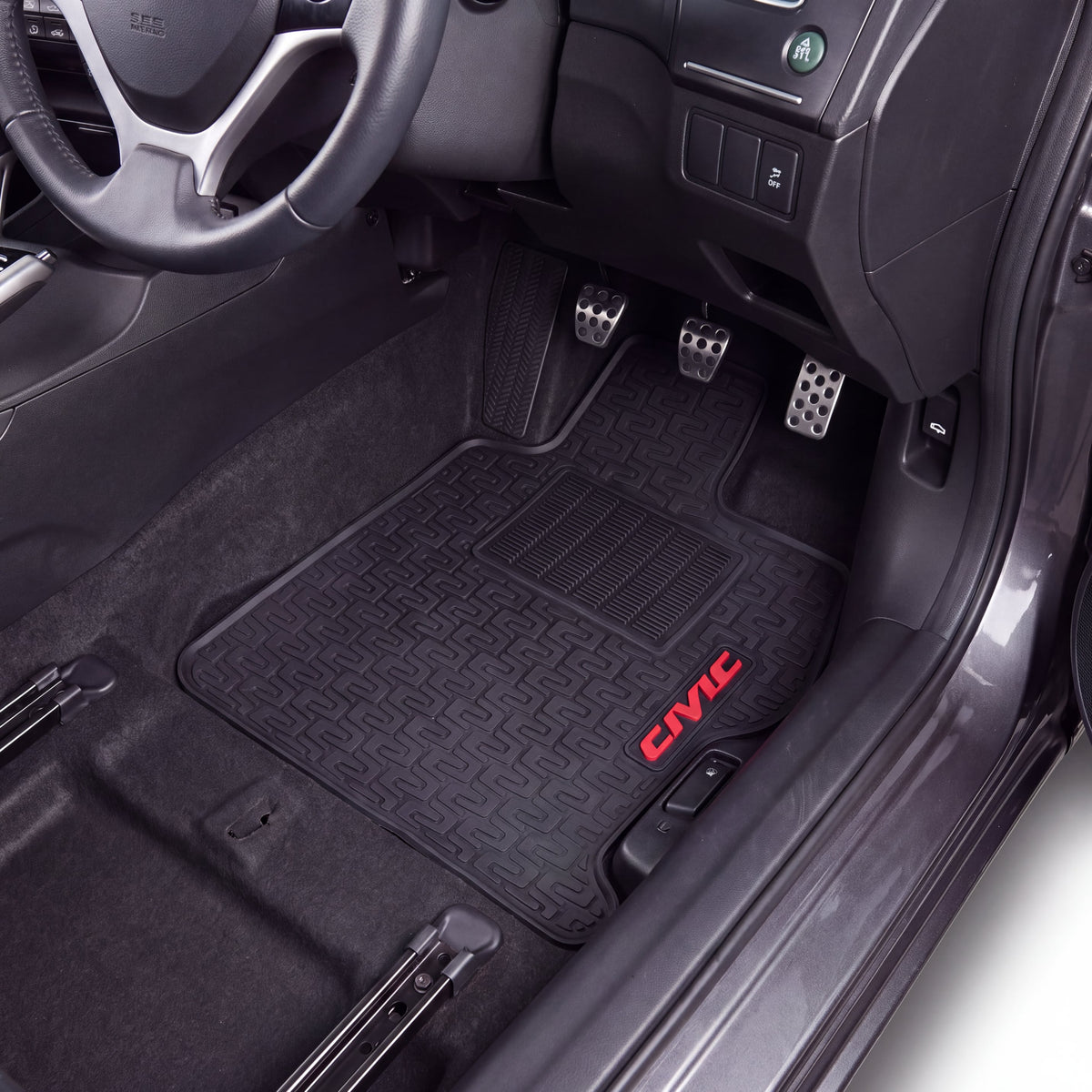 Black car floor mats installed in the driver and passenger footwells of a Honda Civic, with the red 'CIVIC' logo embroidered on the passenger mat.