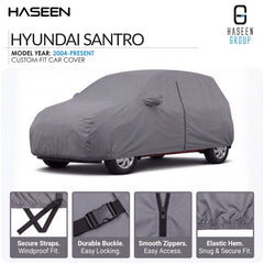 A gray custom-fit car cover shown on a Hyundai Santro, with Haseen branding and feature callout panels at the bottom detailing secure straps, durable buckle, smooth zippers, and elastic hem.