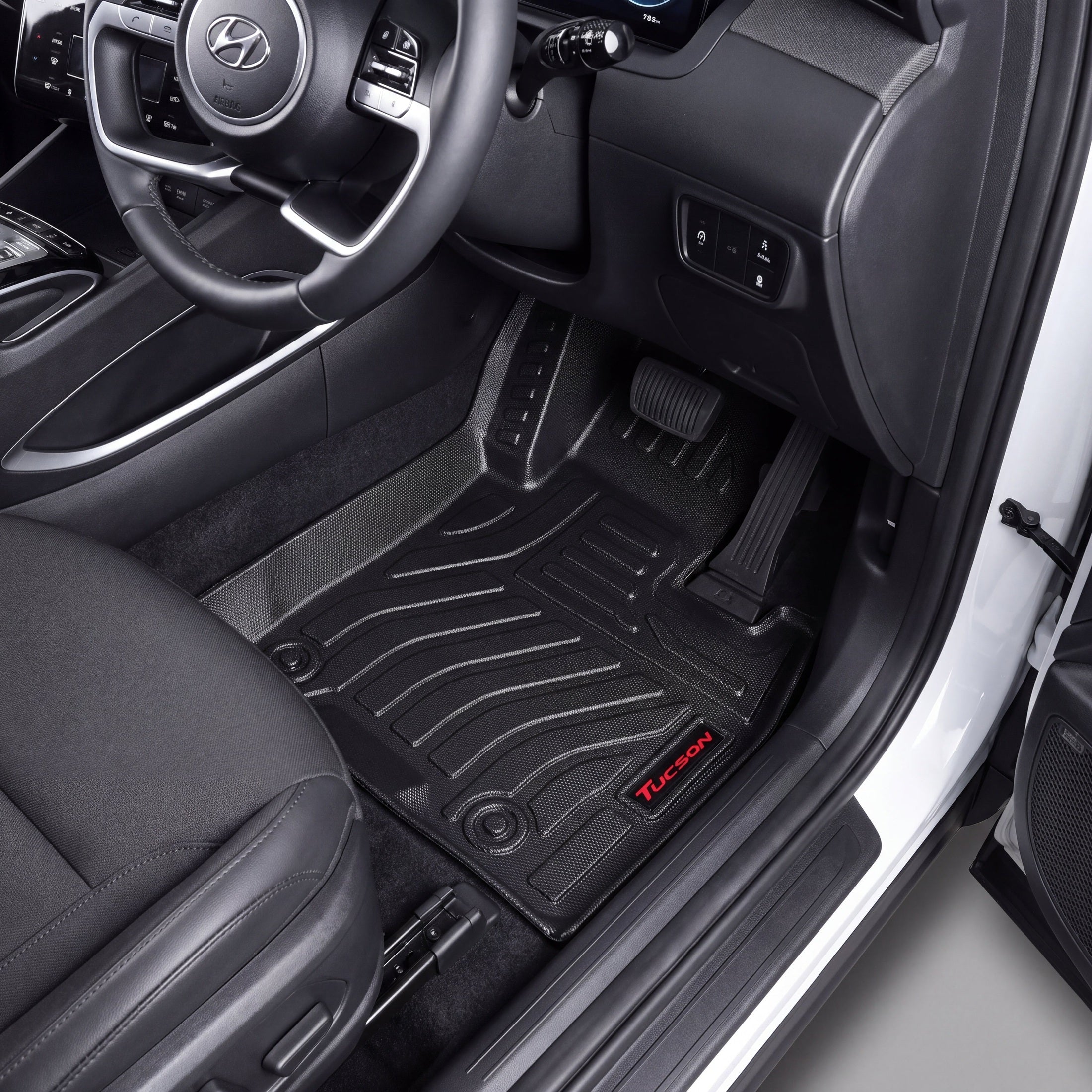 Haseen Hyundai Tucson Hybrid 2025 9D TPE car floor mats installed – black molded mats with red Tucson logo, Pakistan