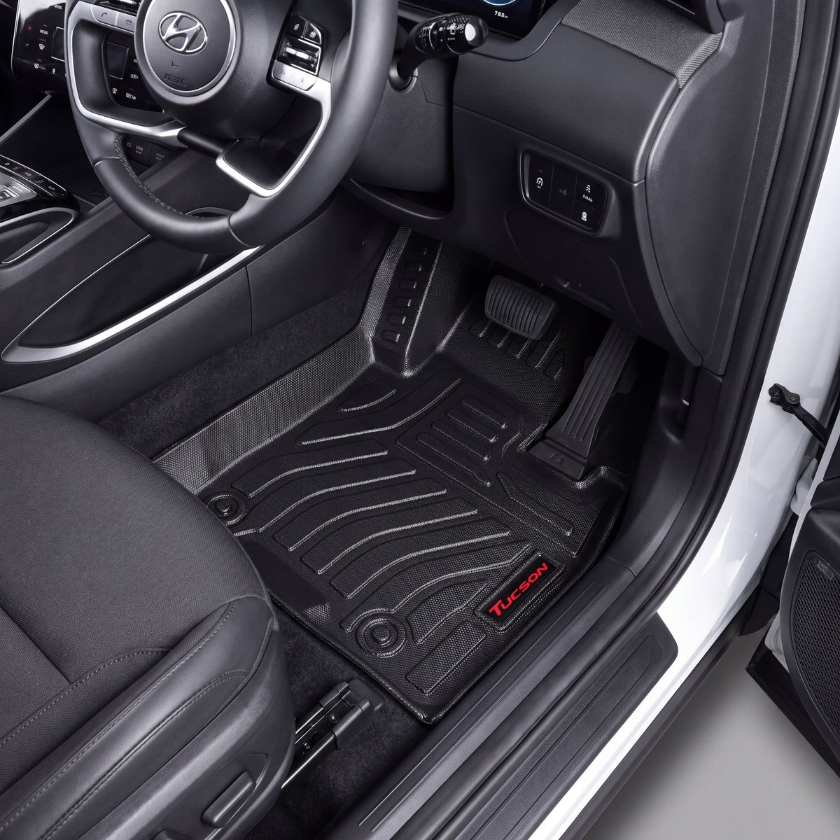 Haseen Hyundai Tucson Hybrid 2025 9D TPE car floor mats installed – black molded mats with red Tucson logo, Pakistan