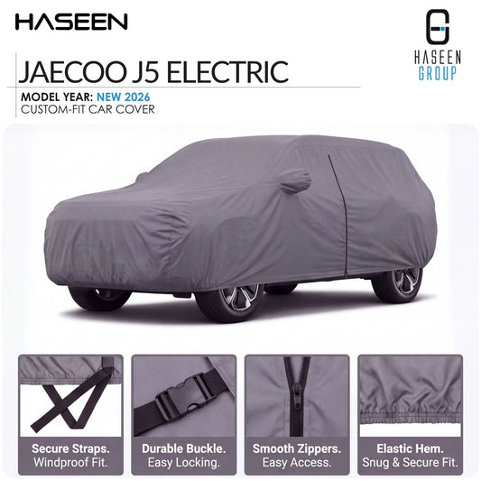 A gray custom-fit car cover shown on a white background, with the text 'JAECOO J5 ELECTRIC' and 'HASEEN GROUP' in the header. Four feature callout panels at the bottom highlight secure straps, durable buckle, smooth zippers, and elastic hem.