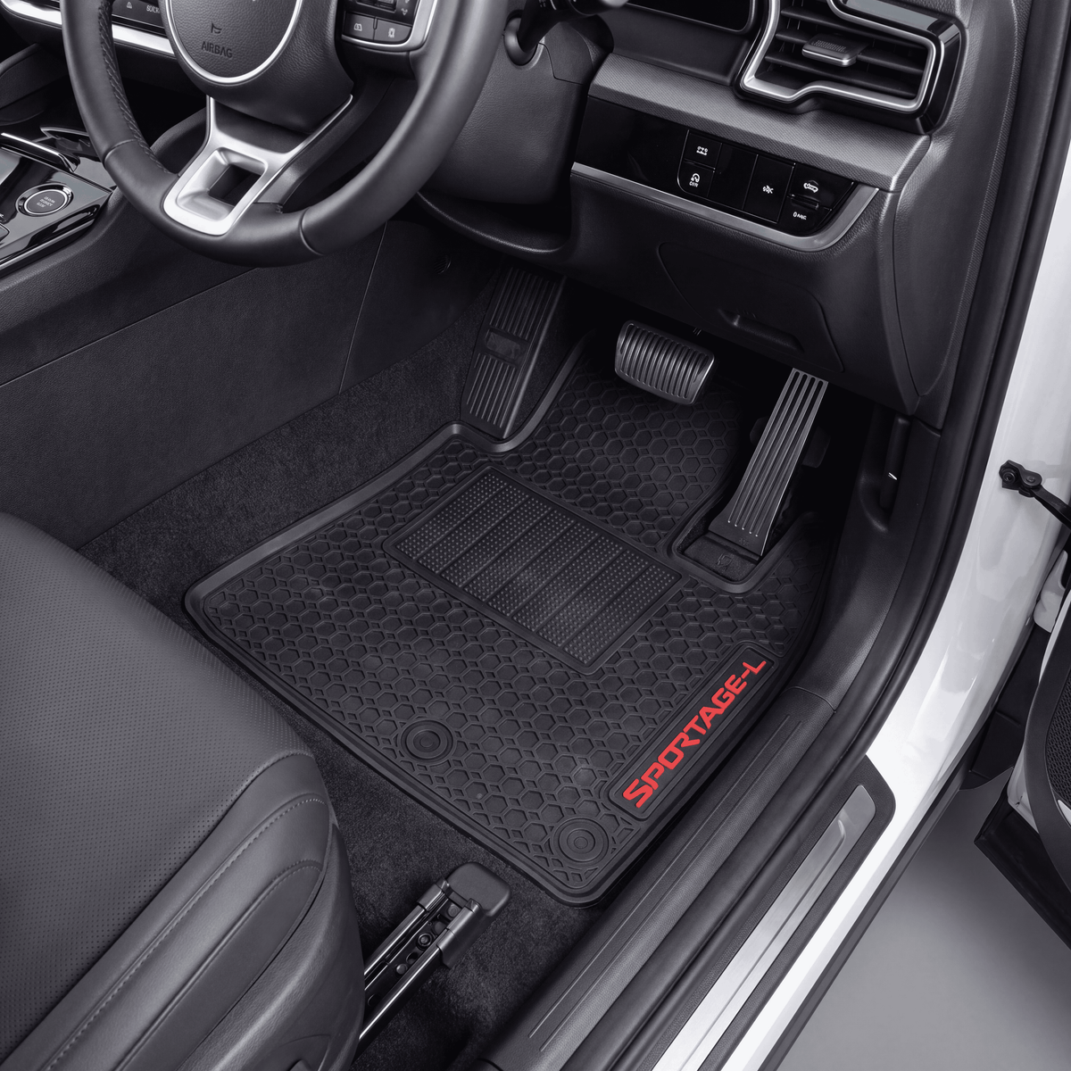 Black rubber car floor mats with a honeycomb pattern and red SPOTTAGEEL branding, shown installed in the front of a vehicle interior.