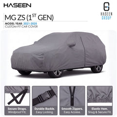 A gray custom-fit car cover shown on a car silhouette, with HASEEN branding and text for MG ZS (1st Gen), model year 2021-2025. Four feature callouts along the bottom highlight secure straps, durable buckle, smooth zippers, and elastic hem.