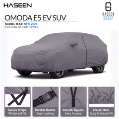 A gray car cover fitted over a vehicle, shown on a white background with HASEEN branding and feature callouts for the OMODA E5 EV SUV. Four inset detail panels at the bottom highlight secure straps, a durable buckle, smooth zippers, and elastic hem.