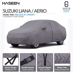 A gray custom-fit car cover shown on a white background, labeled for Suzuki Liana / Aerio model years 2006-2014. The image includes the Haseen and Haseen Group branding and four feature callouts at the bottom highlighting secure straps, durable buckle, smooth zippers, and elastic hem.