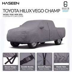 A gray custom-fit car cover shown on a Toyota Hilux pickup truck against a white background, with HASEEN branding and feature callouts below. The text specifies 'TOYOTA HILUX VEGO CHAMP' and 'MODEL YEAR: NEW 2026'.
