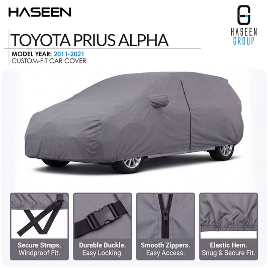 A gray custom-fit car cover shown on a white background, with the text 'TOYOTA PRIUS ALPHA' and 'HASEEN GROUP' at the top, plus four feature close-up panels along the bottom describing secure straps, durable buckle, smooth zippers, and elastic hem.