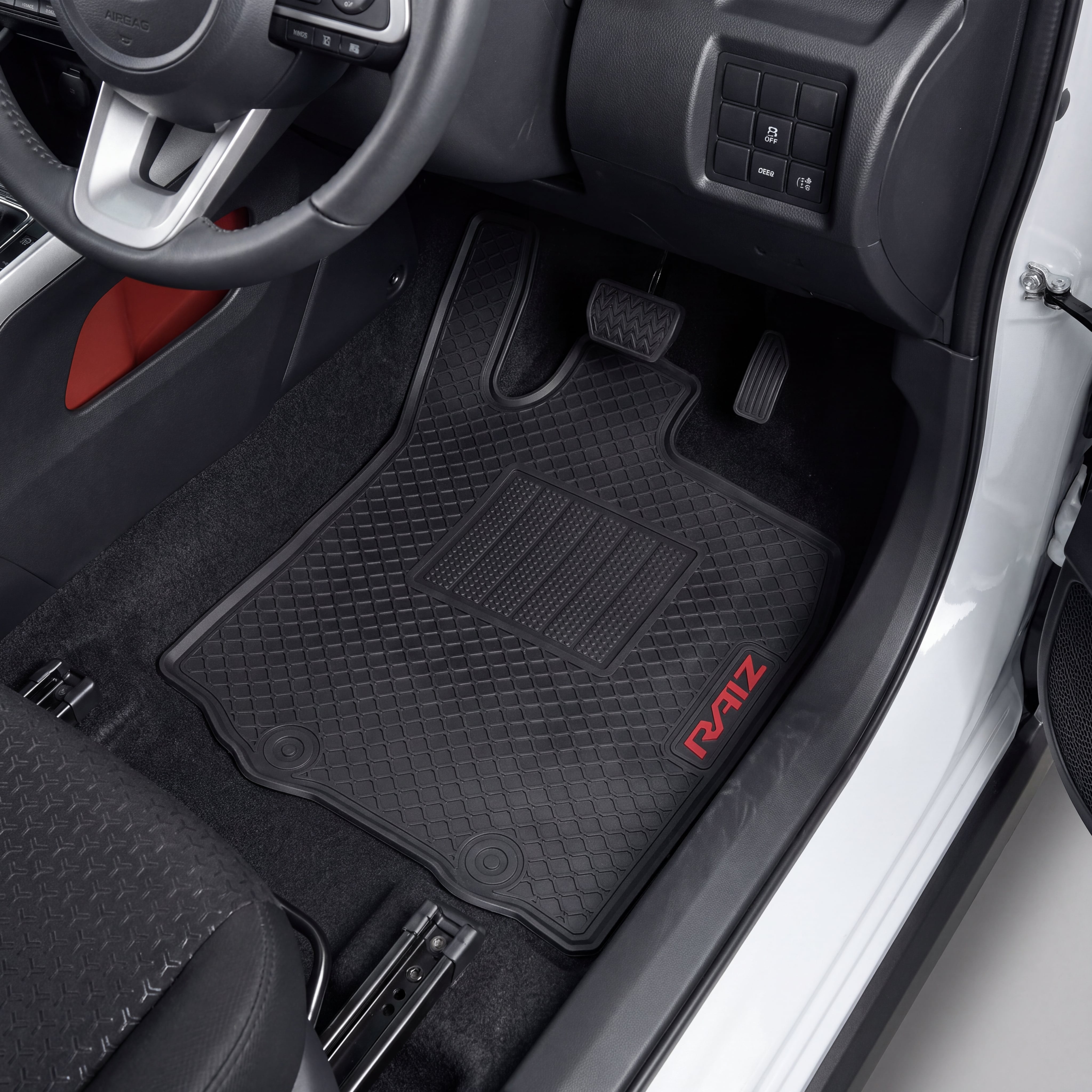 Black car floor mats with a diamond-embossed pattern and a red 'RAIZE' logo, shown installed inside a vehicle's driver's side footwell.