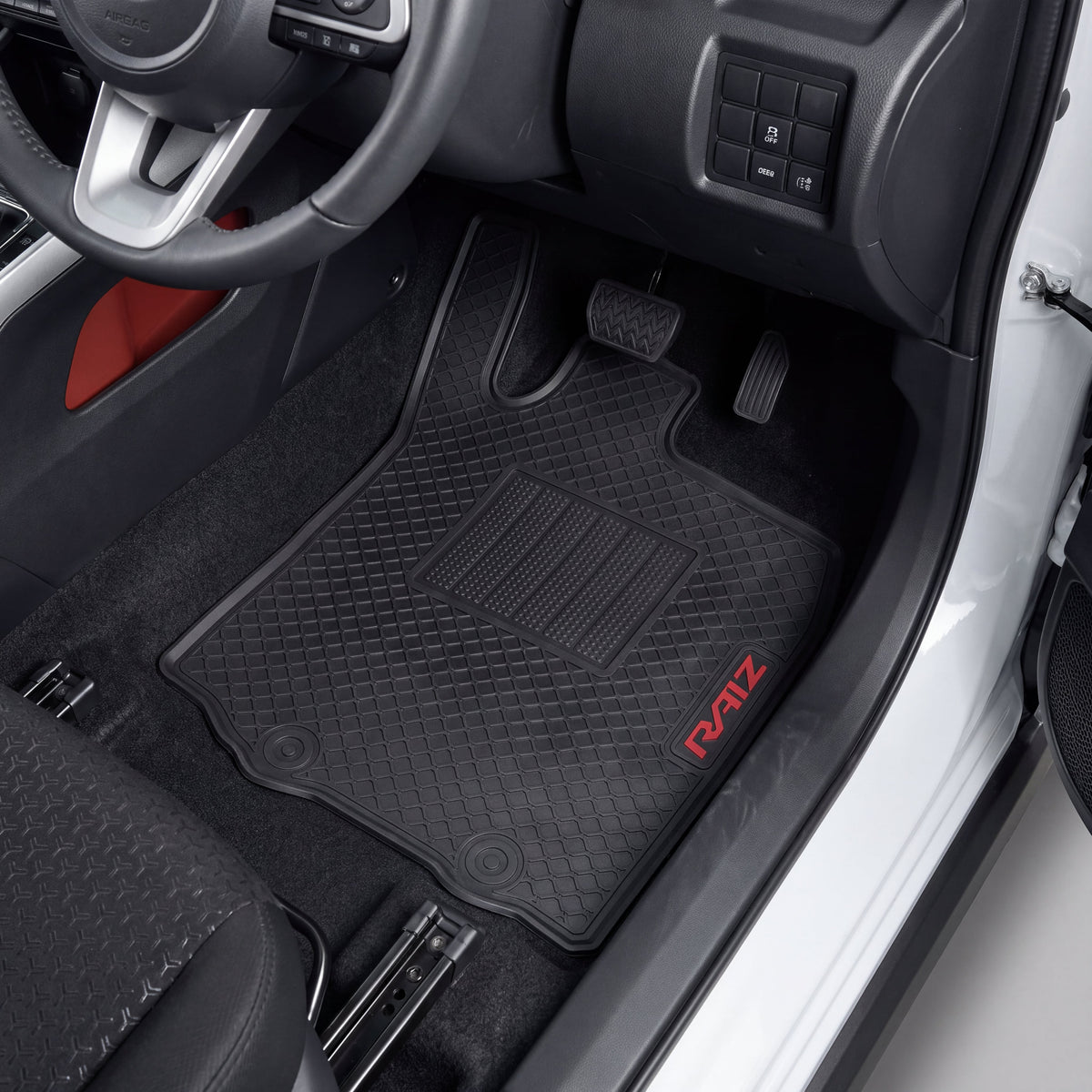 Black car floor mats with a diamond-embossed pattern and a red 'RAIZE' logo, shown installed inside a vehicle's driver's side footwell.