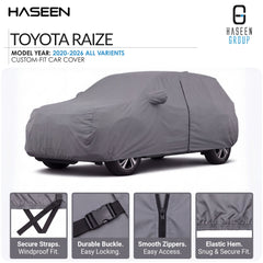 A gray custom-fit car cover shown on a white background, with the text 'TOYOTA RAIZE' and 'HASEEN GROUP' at the top. Four feature callout panels along the bottom highlight secure straps, durable buckle, smooth zippers, and elastic hem.
